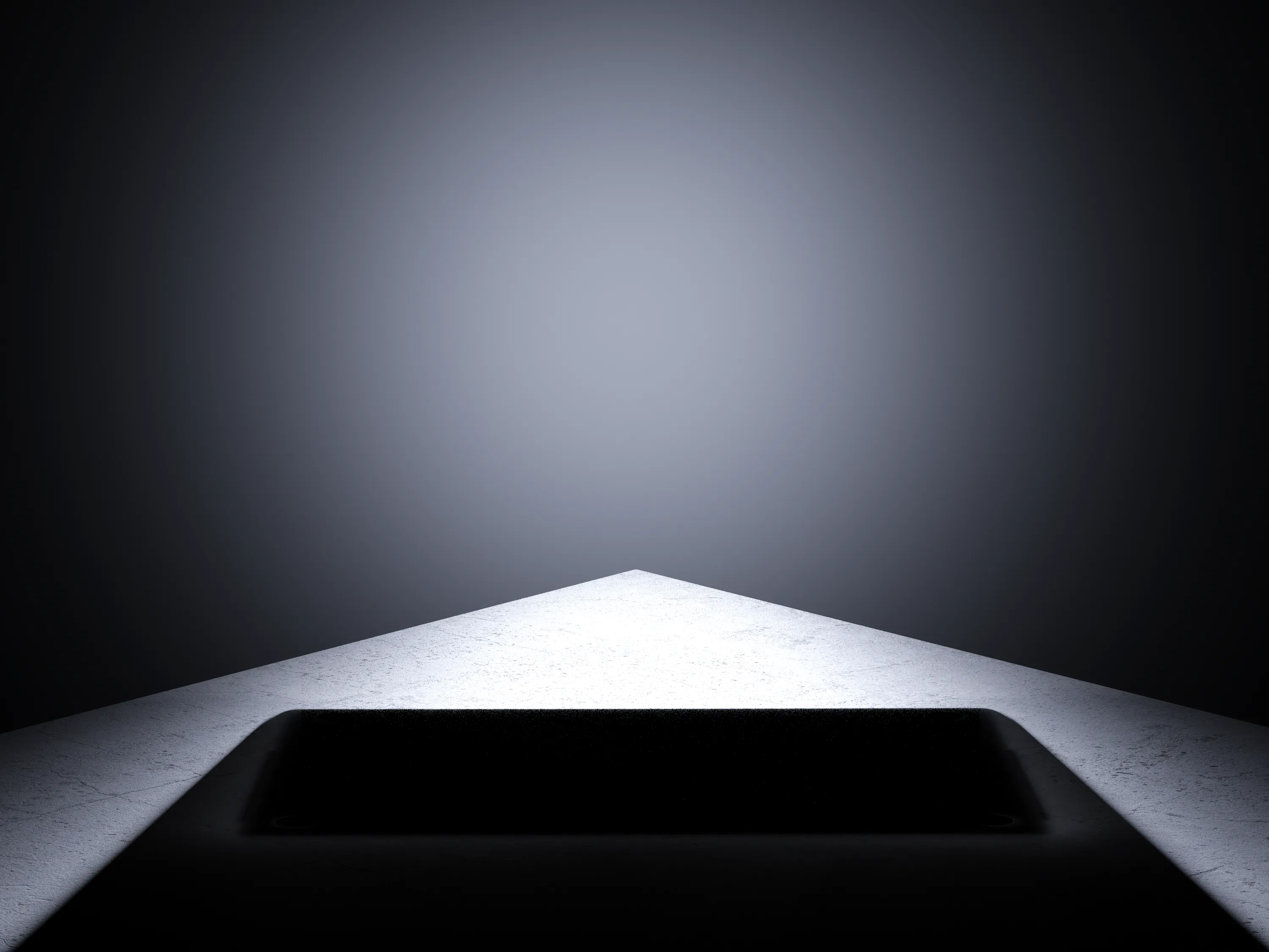 A dark studio set lit from one side